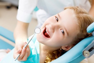 girl smiling dentist chair