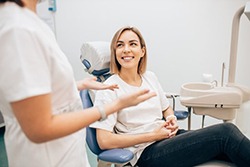 woman talking with her cosmetic dentist in San Antonio 