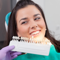 Smiling senior man in dental chair