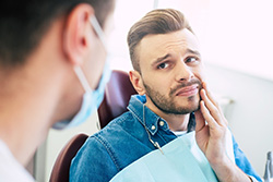 Man visiting his San Antonio emergency dentist 