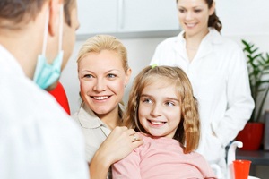 girl and mother at dentist