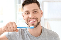 Man brushes teeth in San Antonio