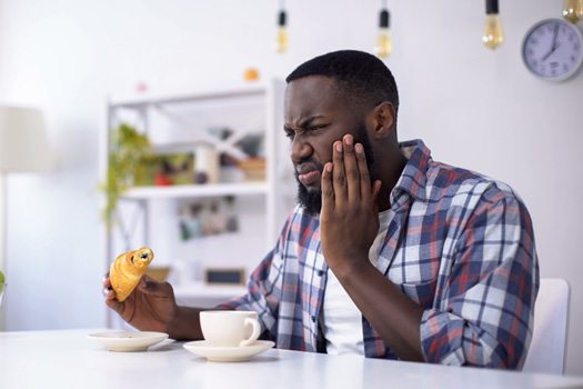 Man with tooth sensitivity