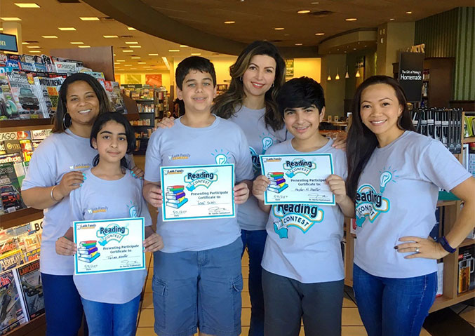 children holding up awards