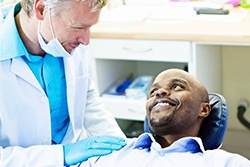 Young man smiling at dentist
