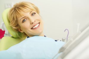 smiling person on dental chair