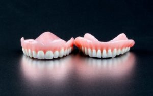 dentures on black background