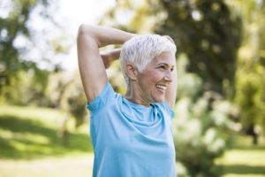 person stretching and smiling