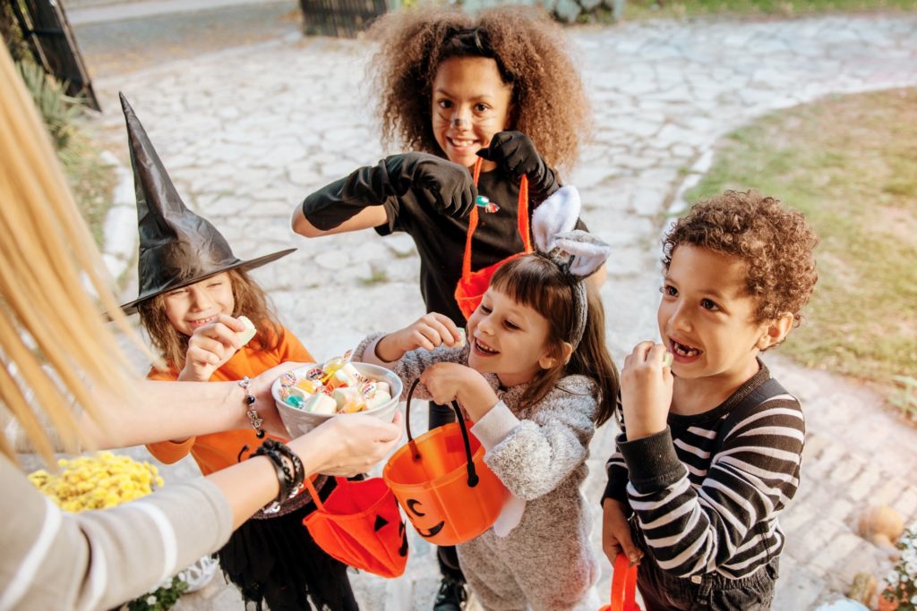 Closeup of children trick-or-treating in their costumes