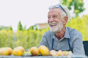 mature man smiling with dentures 