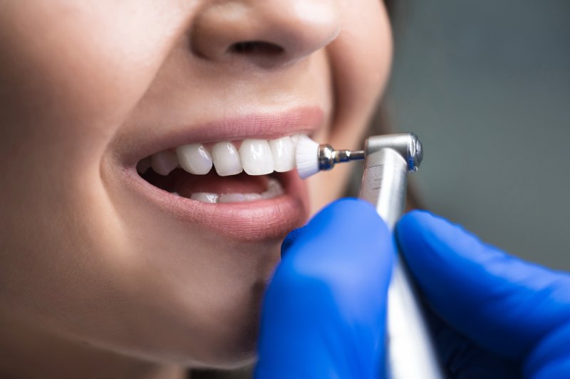 patient smiling during a teeth cleaning