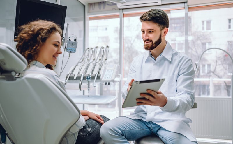 Dentist talking to a patient