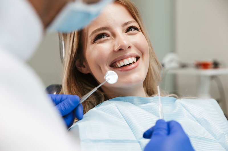 A smiling woman attending a dental checkup